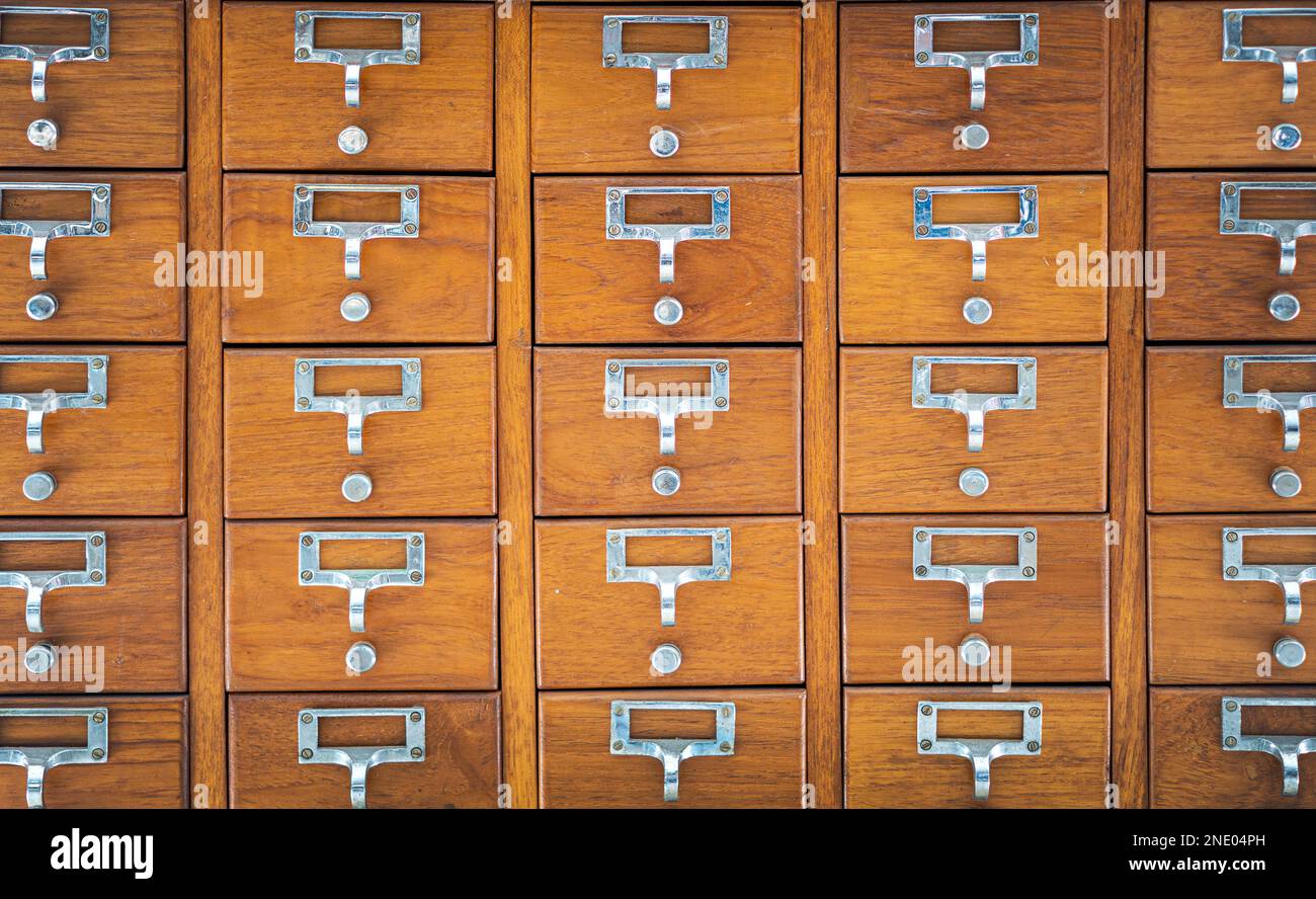 old fashion apothecary wood chest with drawers to keep data and medical