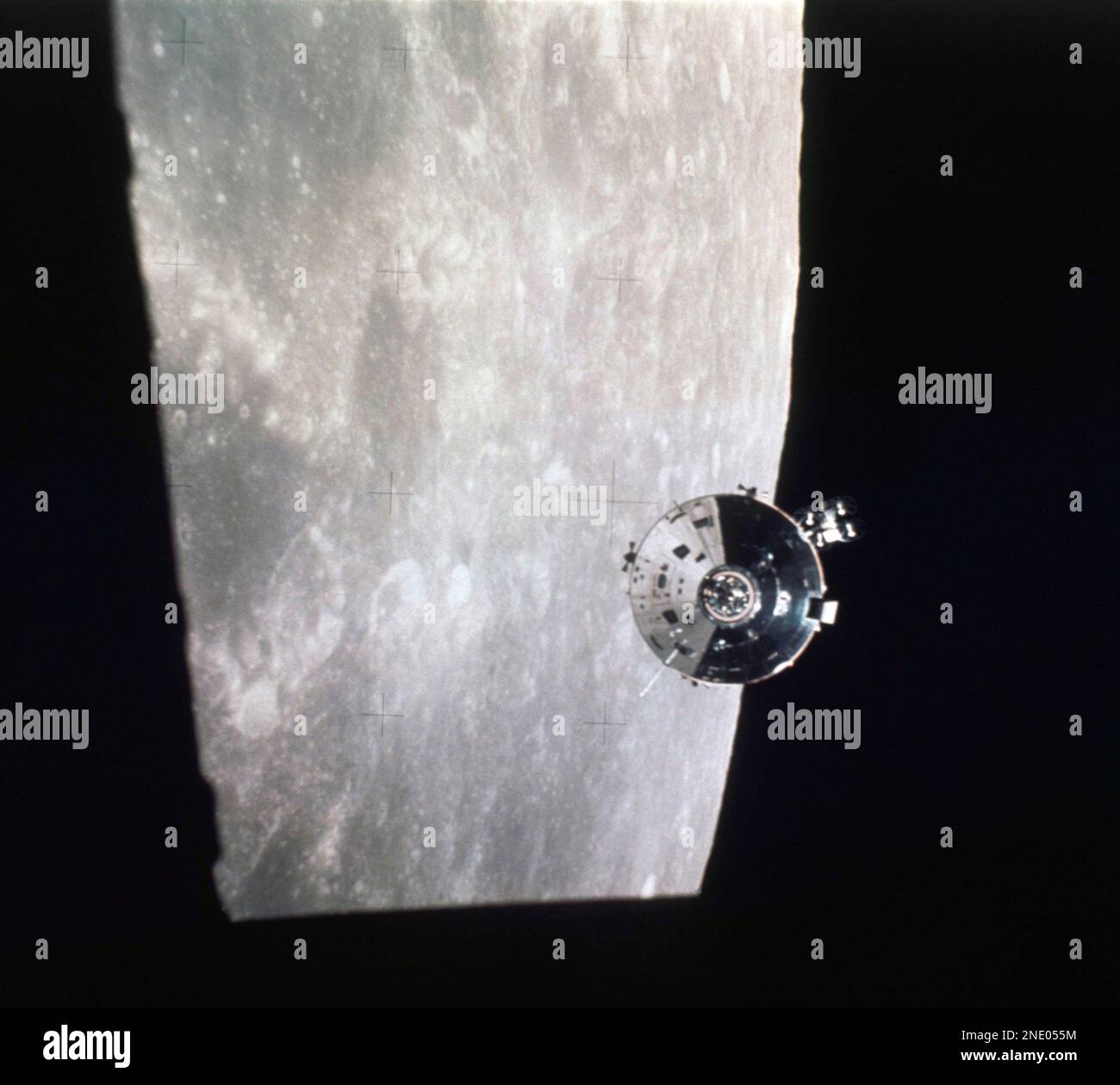 The Apollo 15 Command and Service Modules are shown high above the ...