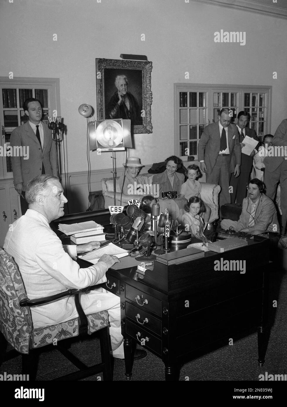 President Franklin Roosevelt seated at the desk once used by former