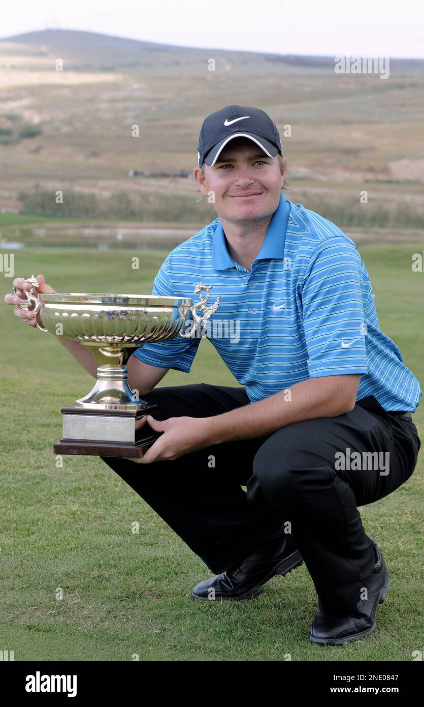 England's James Morrison poses with his trophy after winning the Madeira  Islands Open golf tournament, on the Portuguese Atlantic island of Porto  Santo, Sunday, April 11 2010. Morrison finished 20 under par,