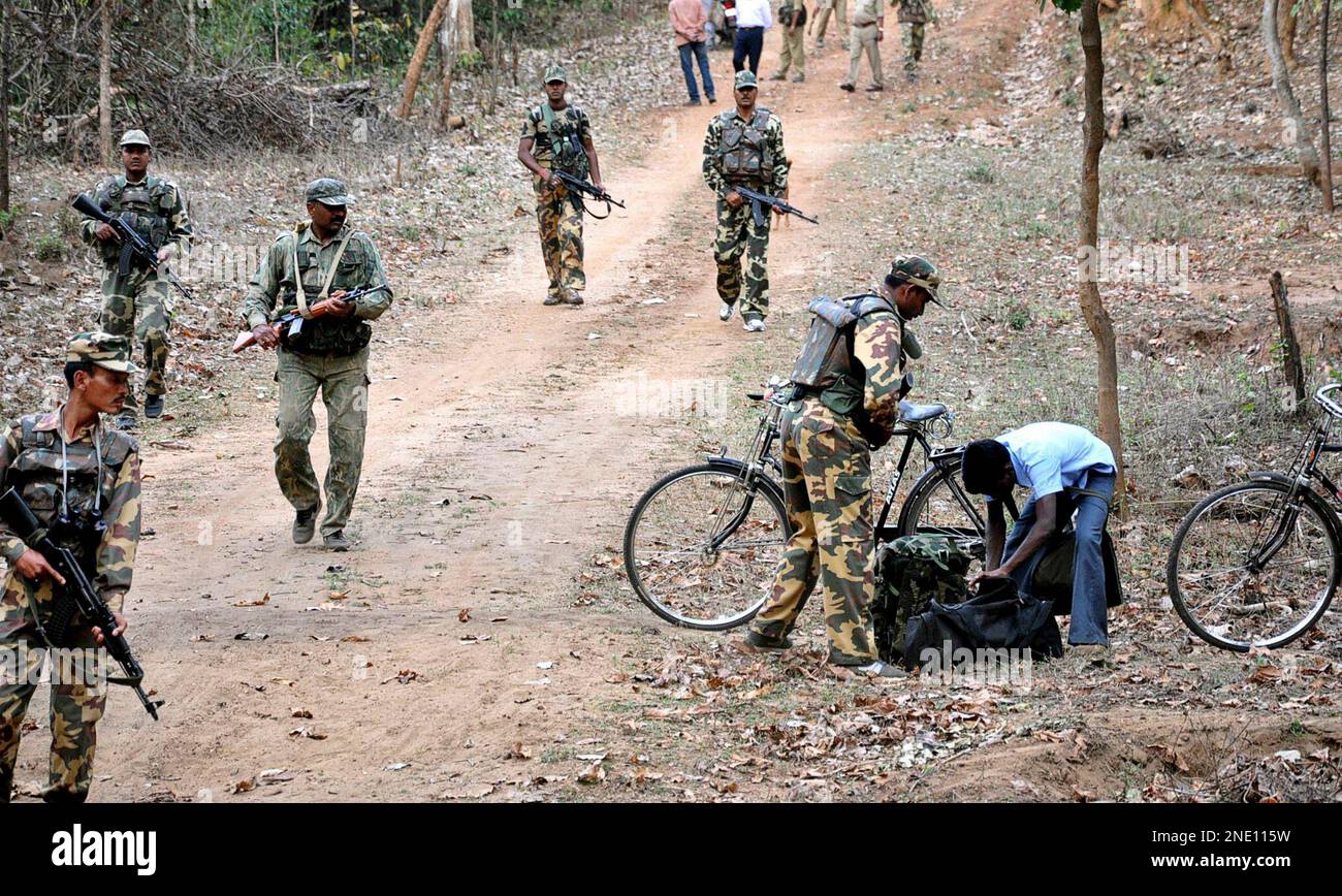 FILE - In this March 17, 2010 file photo, Indian paramilitary soldiers patrol during a combing operation under "Operation Green Hunt," to flush out Maoist rebels from their strongholds, near the jungles of Betla, about 210 kilometers (132 miles) northeast of Ranchi, India. Maoist rebels killed at least 60 paramilitary soldiers in attacks Tuesday April 6, 2010, in eastern India, a senior police official said, the most casualties since government forces launched an offensive against the insurgents last year. (AP Photo/Sasanka Sen, File) Stock Photo