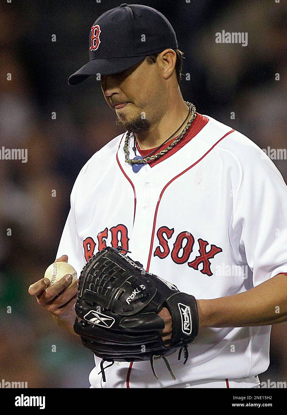 Boston Red Sox starting pitcher Josh Beckett handles the ball between