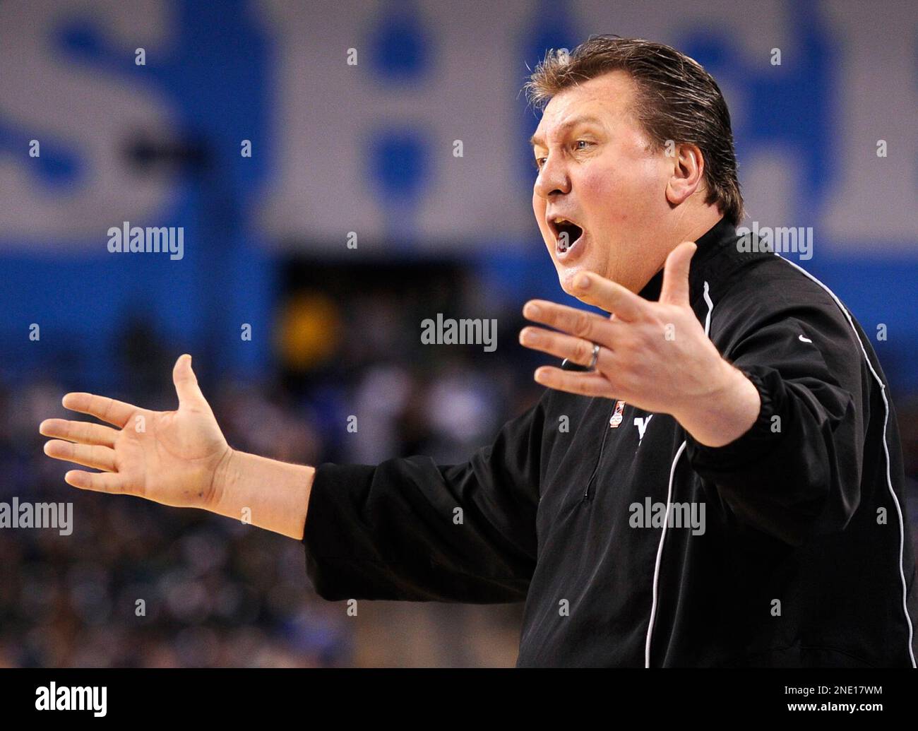 West Virginia head coach Bob Huggins gestures to his team during the first half against Duke in