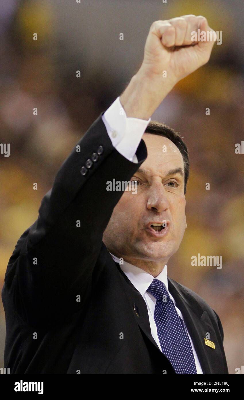 Duke head coach Mike Krzyzewski signals to his team during the first