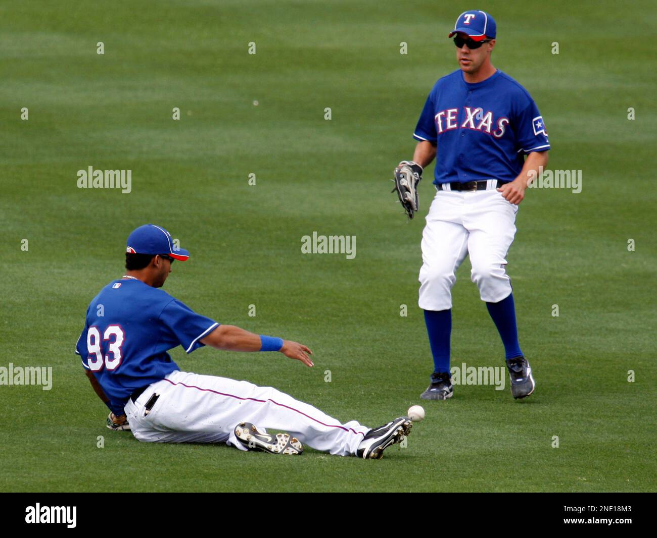 Texas Rangers infielder Renny Osuna (93) misses the ball as