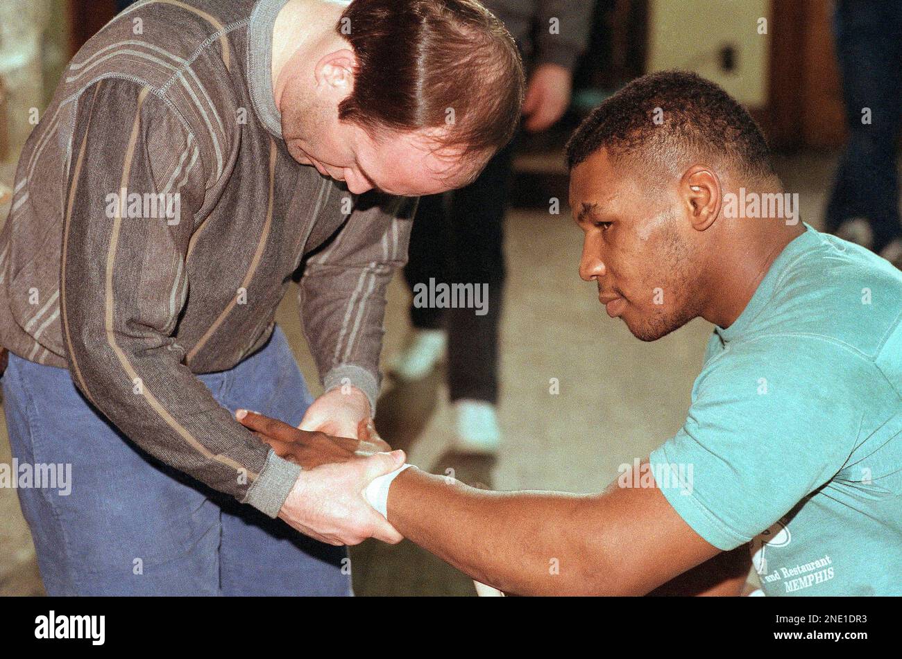 Heavyweight boxer Mike Tyson is shown with his trainer, Kevin Rooney