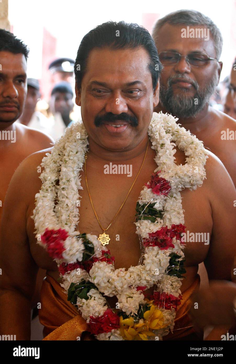sri-lankan-president-mahinda-rajapaksa-comes-out-of-the-nallur-hindu-temple-after-attending-religious-observances-in-jaffna-sri-lanka-thursday-april-1-2010-rajapaksa-visited-tamil-cultural-heartland-jaffna-as-part-of-his-campaigning-for-new-parliamentary-elections-scheduled-on-april-8-ap-photoeranga-jayawardena-2NE1J2P.jpg
