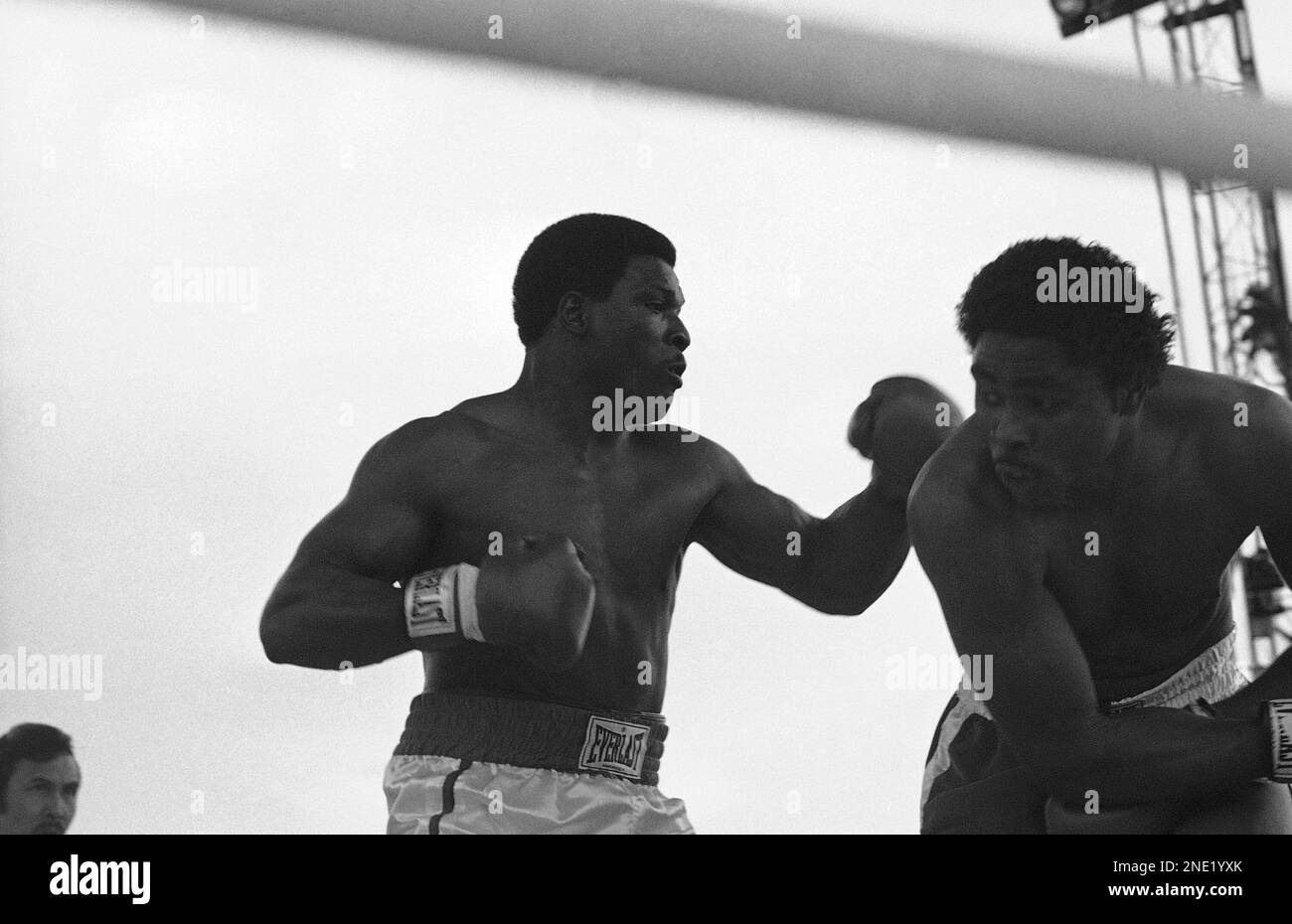 Greg Page of Louisville, Ky., right, dodges left of Trevor Berbick, of