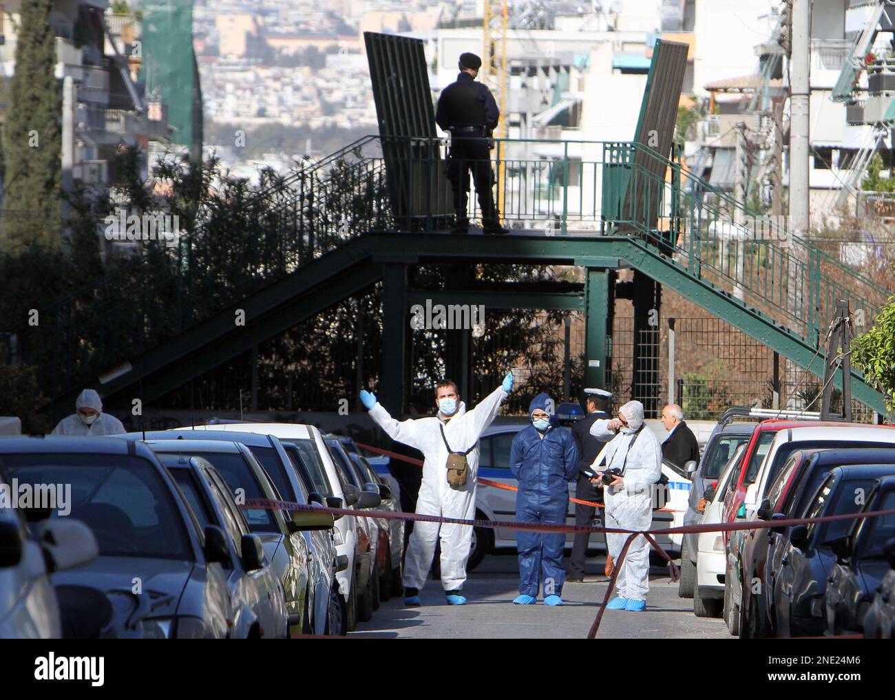 Members of the Greek anti-terrorist team investigate an area after an ...
