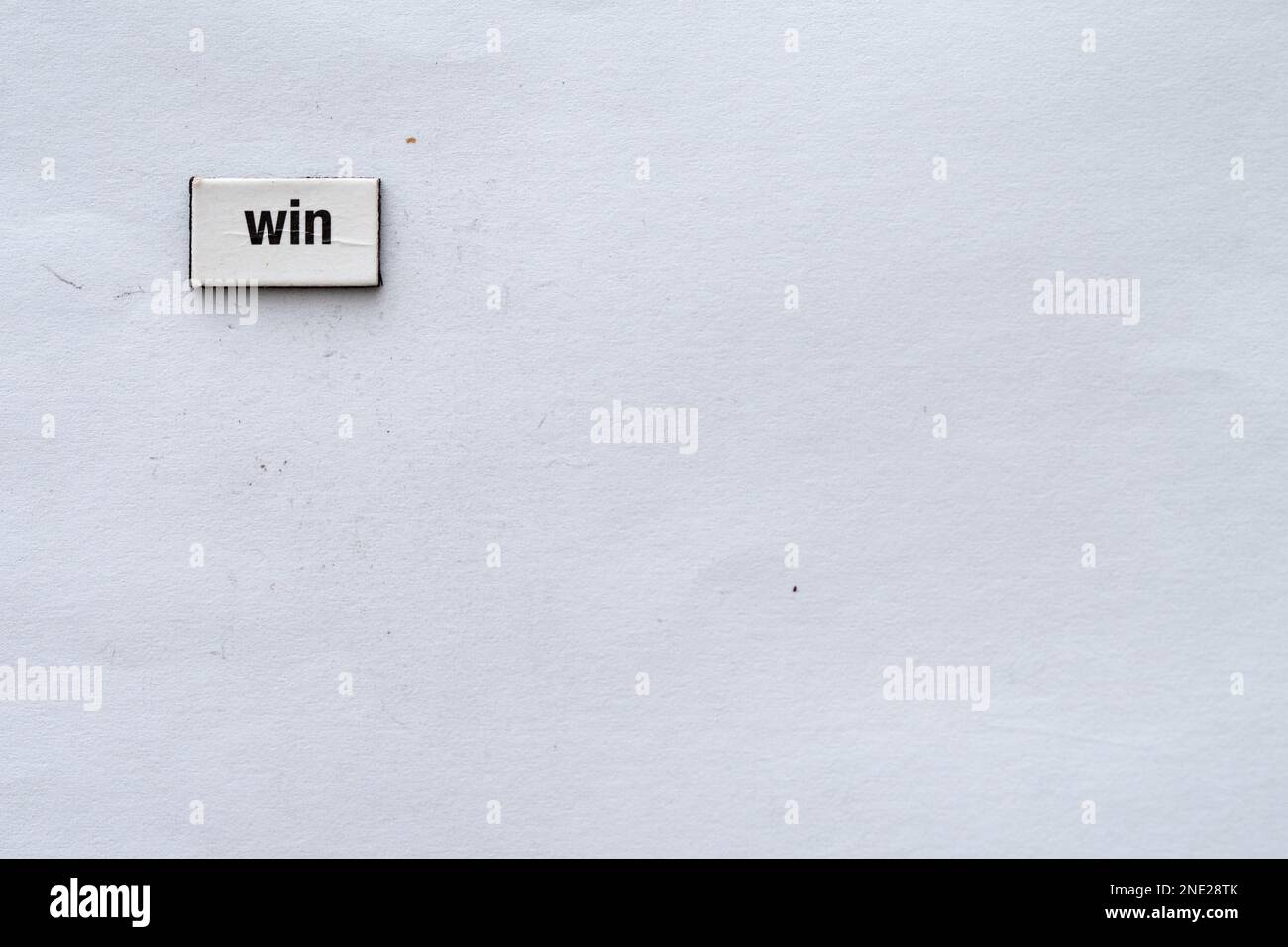 Win wrote on white background Stock Photo - Alamy