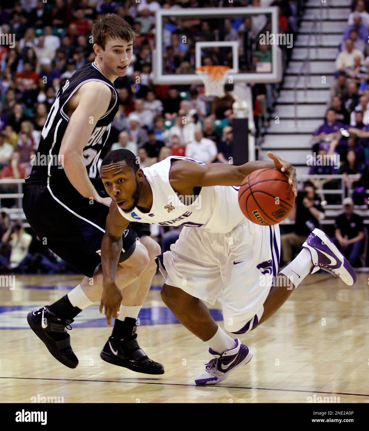 Kansas State's Jacob Pullen, right, tries to dribble past Butler's Gordon Hayward during the