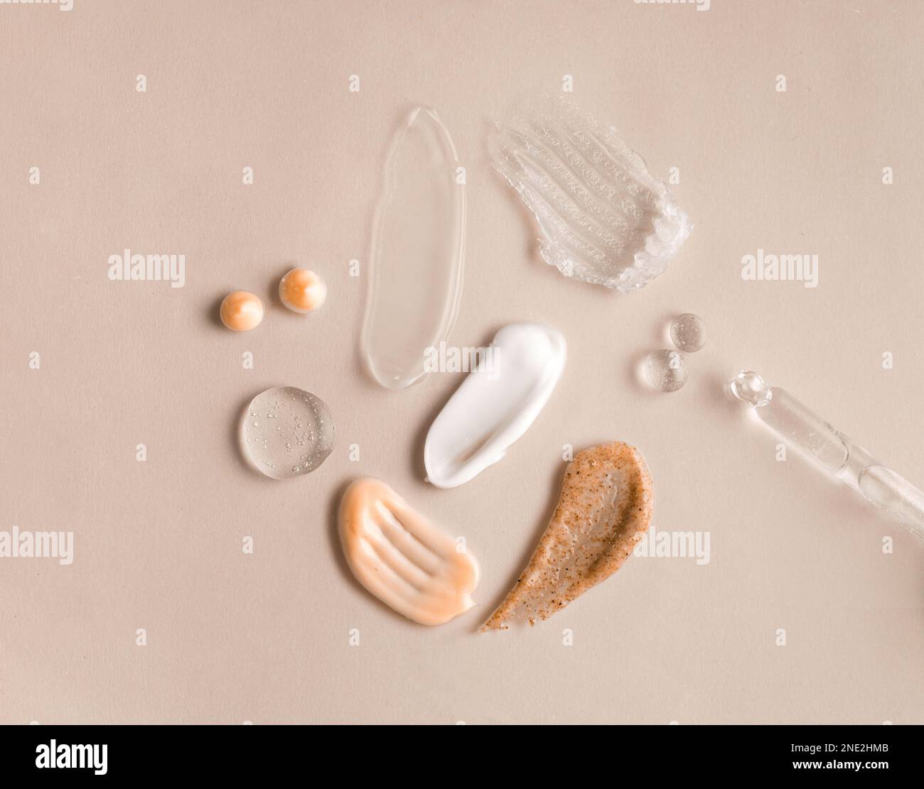 Swatches from various cosmetic products, drops of lotion, smears of