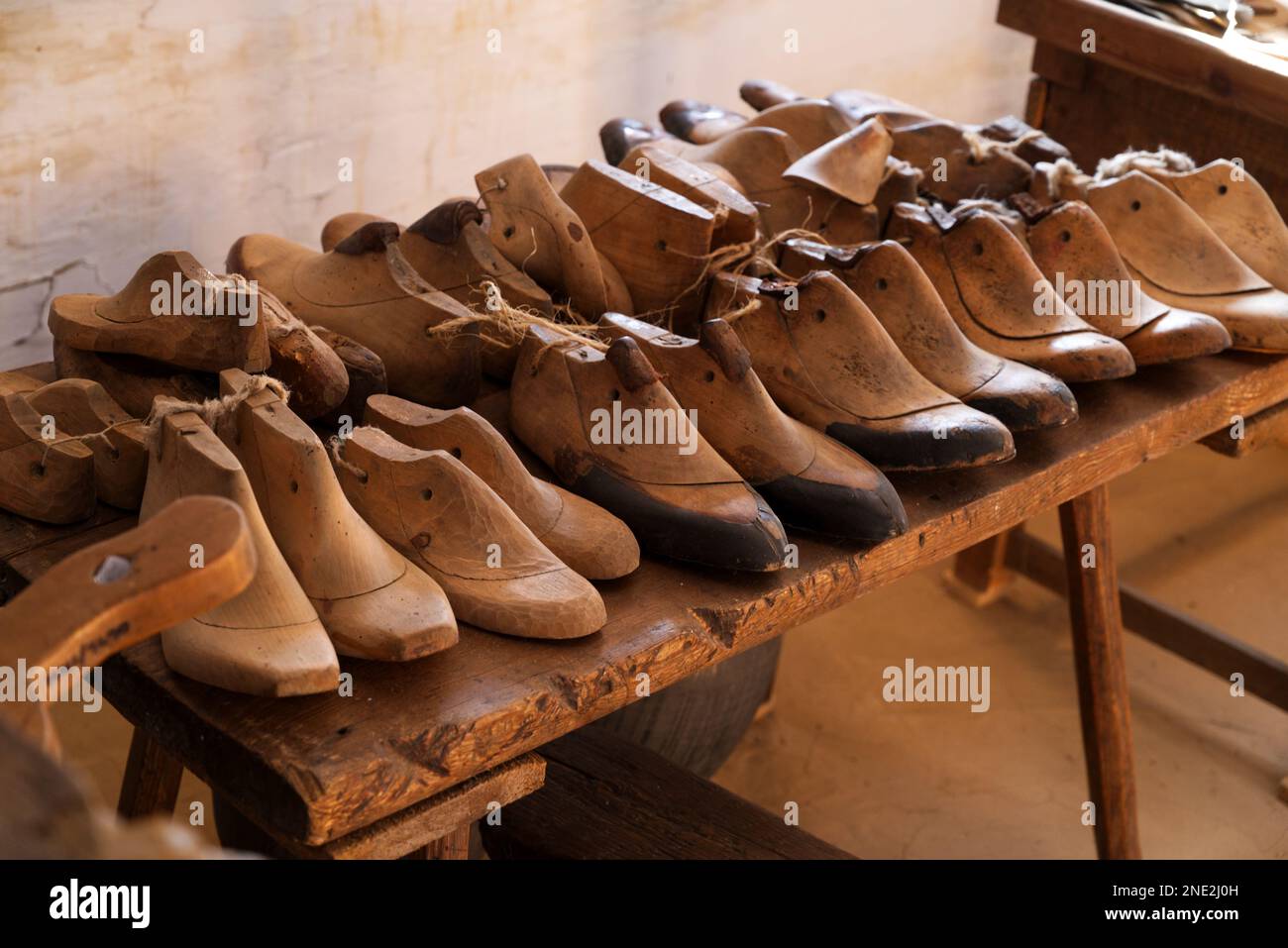 ancient cobbler workshop with wooden shoe molds lined in a row in Lublin, Poland Stock Photo