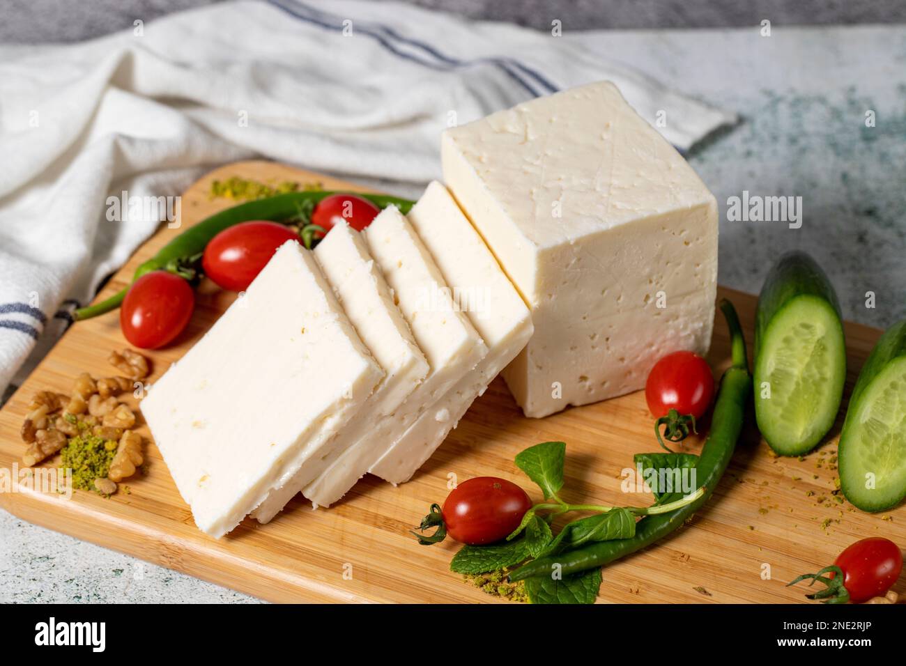 Ripe white cheese. Feta cheese made from cow's milk on a wooden serving