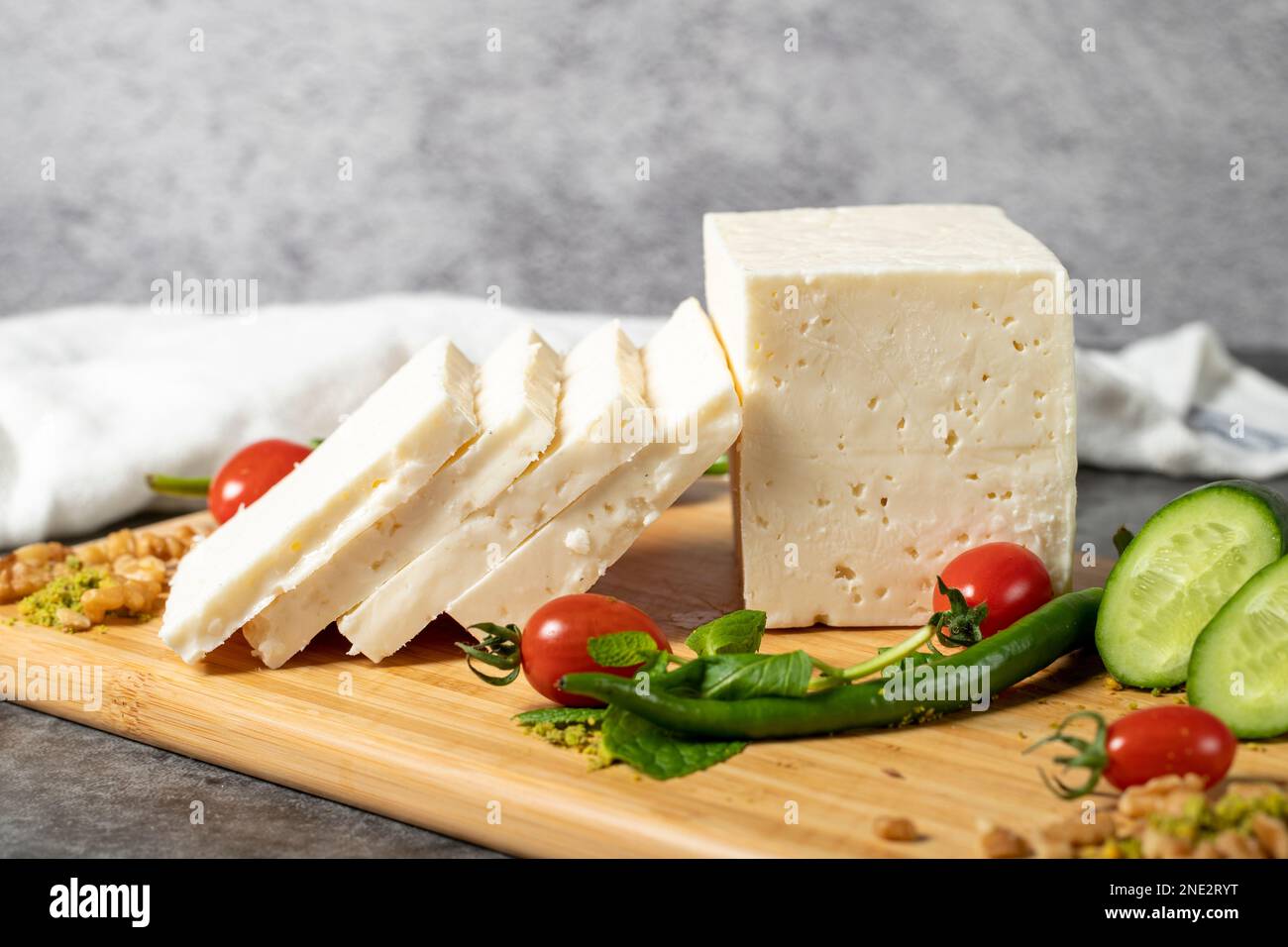 Ripe white cheese. Feta cheese made from cow's milk on a wooden serving