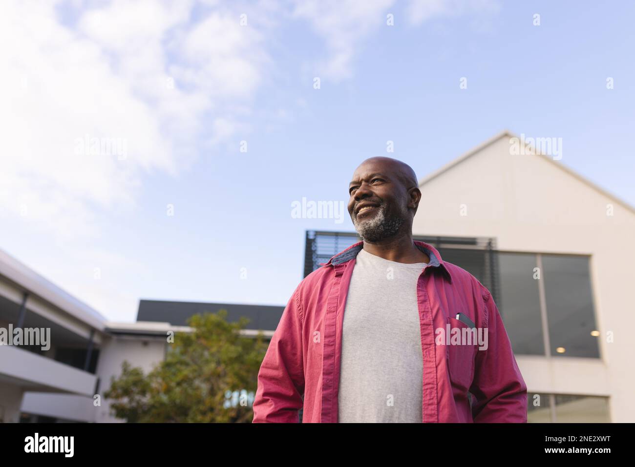 African american senior man smiling while looking away outdoors. retirement senior lifestyle and living concept Stock Photo