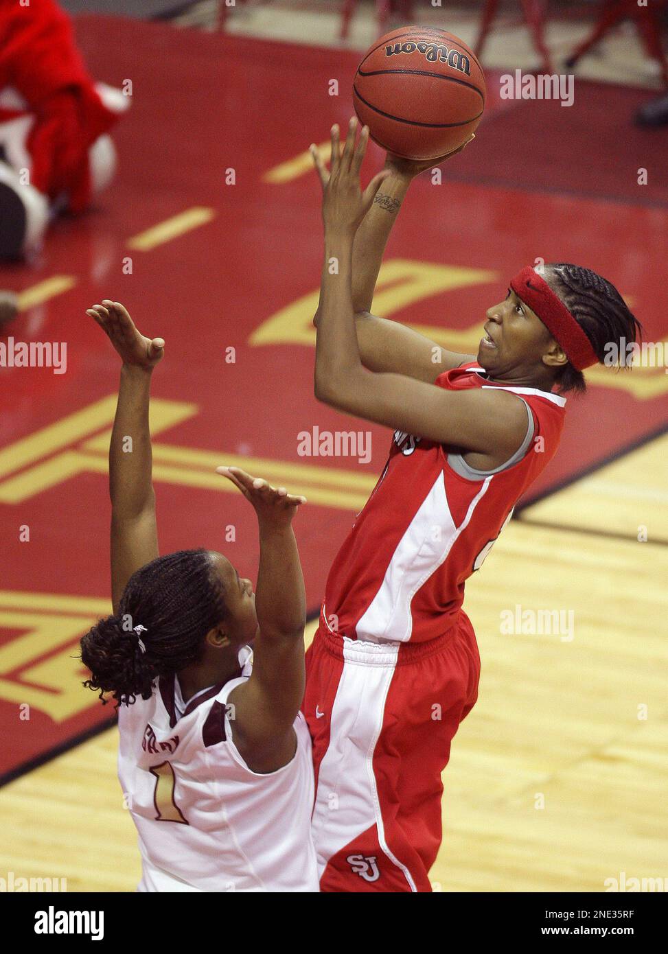 St. John's Shenneika Smith, right, shoots over Florida State's Angel