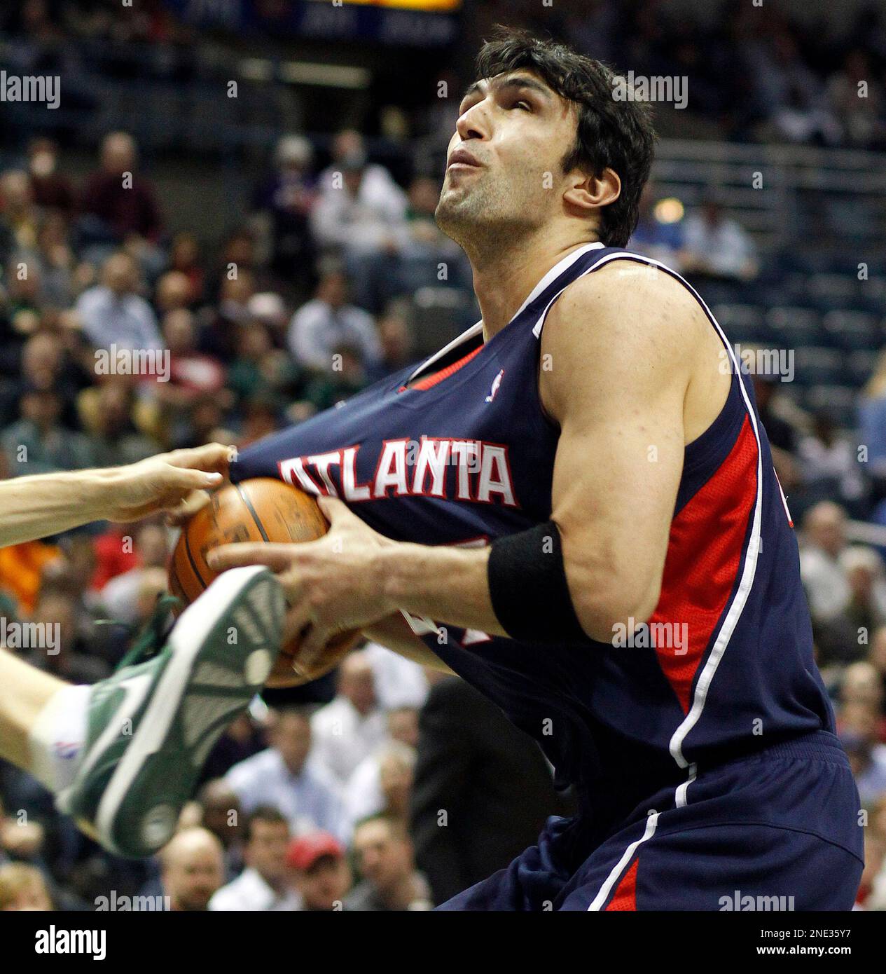 Atlanta Hawks' Zaza Pachulia has his jersey tugged by the Milwaukee Bucks'  Luke Ridnour, not pictured, in the first half of an NBA basketball game  Monday, March 22, 2010, in Milwaukee. (AP