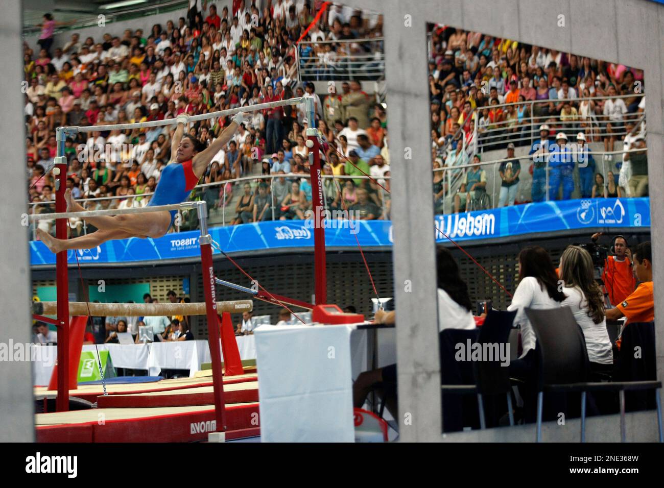 Chile's Makarena Pinto, reflected in a mirror, competes on the uneven