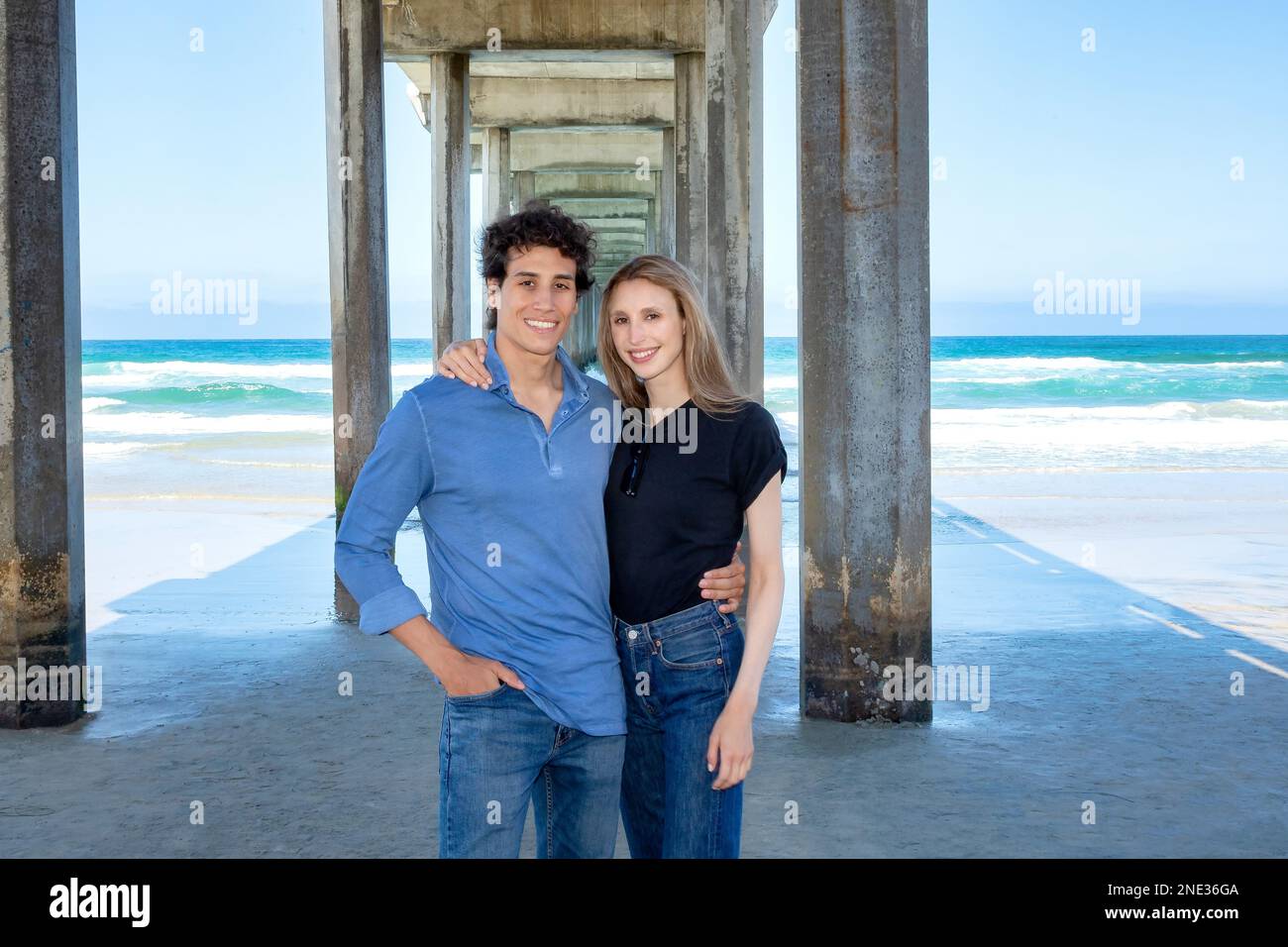 Young couple interlaced at Scripps pier, La Jolla California Stock Photo