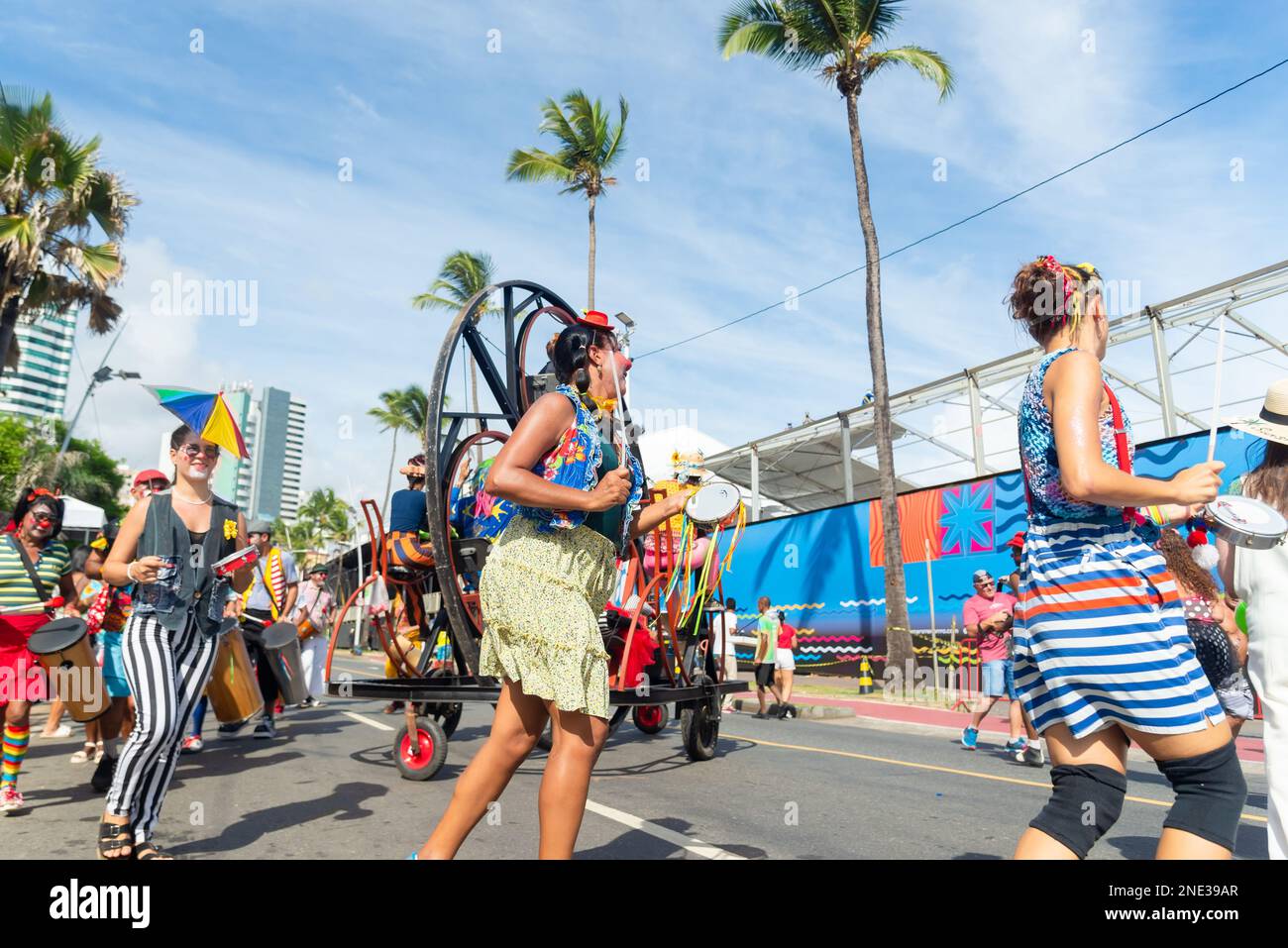 Circus performers dance, sing and play percussion instruments during