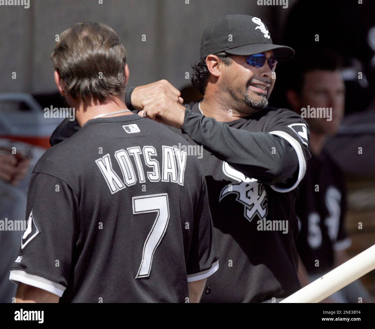 Chicago White Sox manager Ozzie Guillen, right, demonstrates a