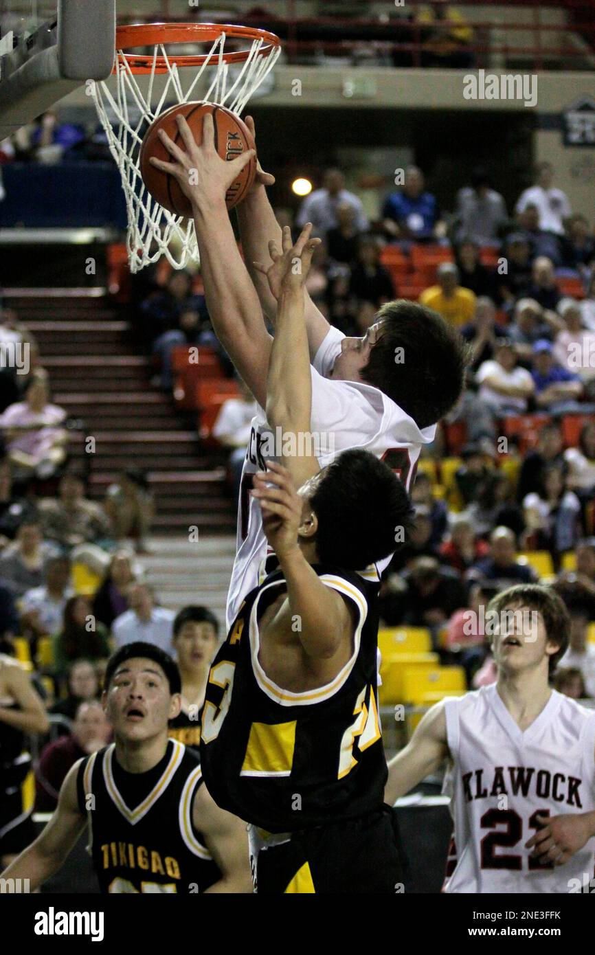 Klawock player Deion Jackson rips a rebound as Pt. Home guard Ebrulik
