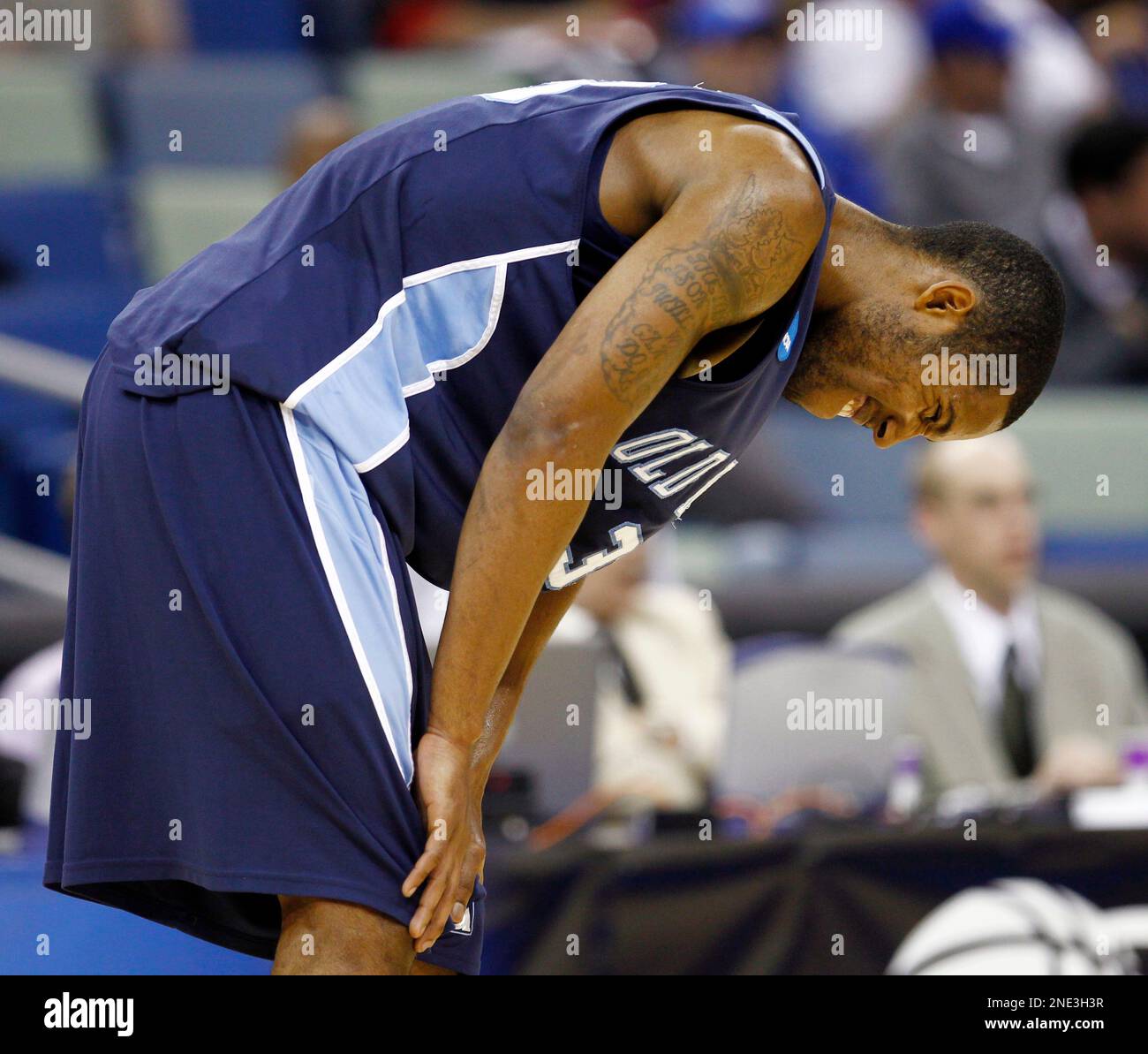Old Dominion guard Darius James (3) grimmaces during a break in the