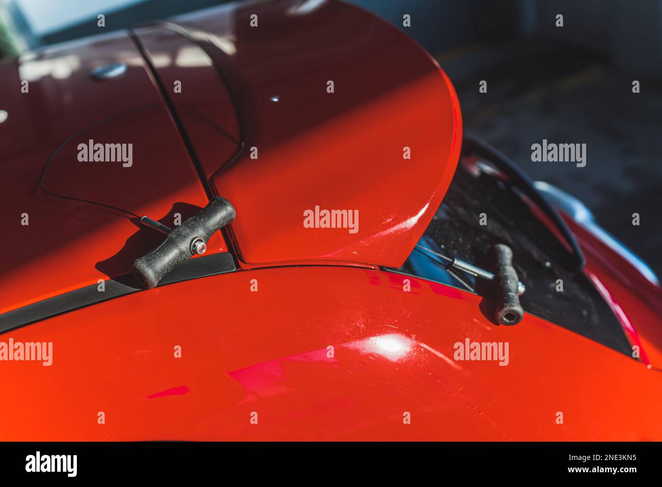Close shot of a car spoiler before being cut with a cutting cord. High quality photo Stock Photo