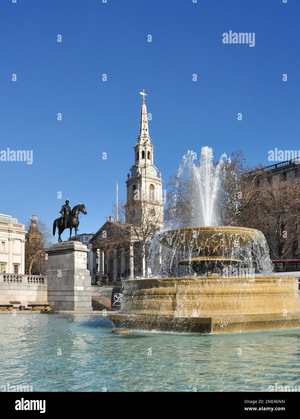 The Church of St Martin-in-the-Fields, equine statue of King George IV and fountain in Trafalgar Square, London, England, UK Stock Photo