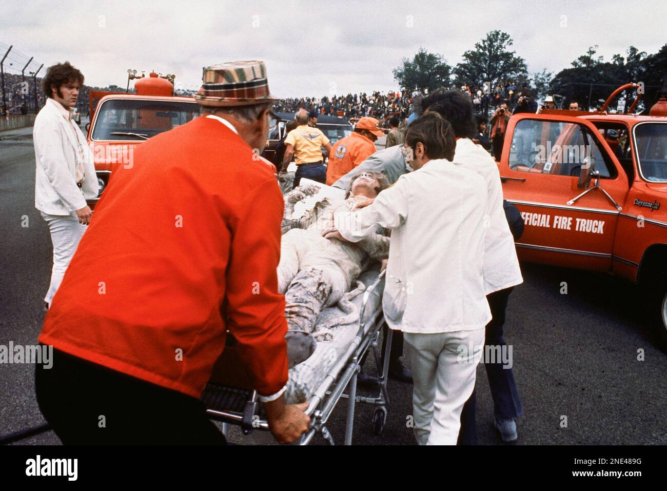 Swede Savage is taken to an ambulance on a stretcher after he crashed