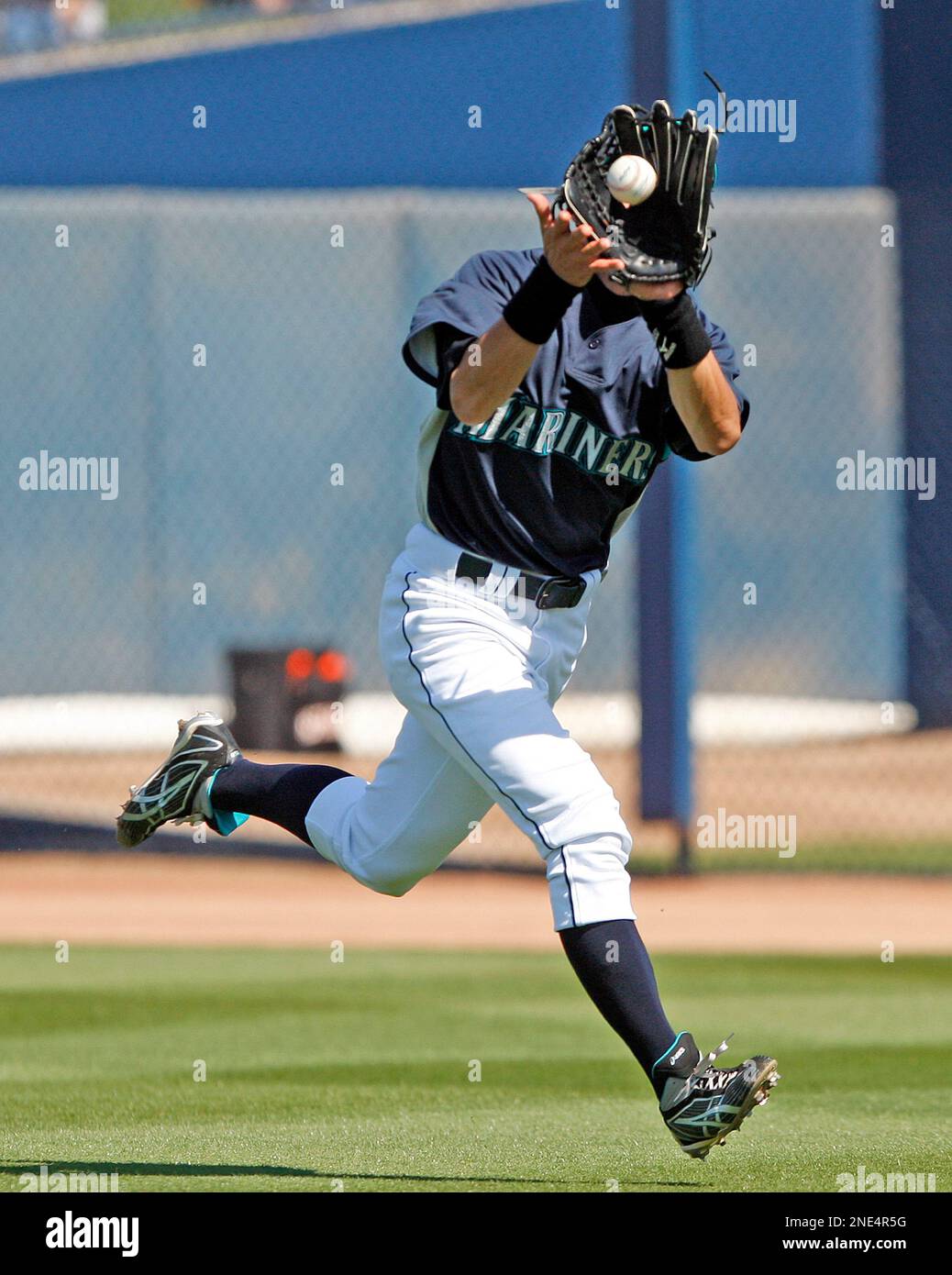 Seattle Mariners right fielder Ichiro Suzuki runs down a fly ball hit down  the line by San Francisco Giants Fred Lewis in the second inning of a  spring training baseball game Saturday