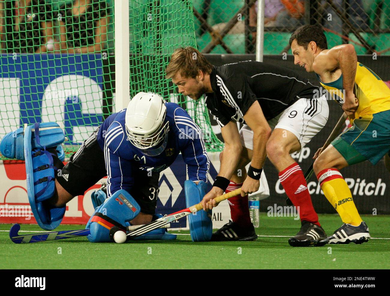 Mens field hockey goalkeeper in England coming out to warm-up Stock Photo -  Alamy