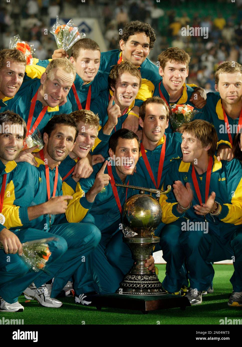 The Australian team poses with the trophy during the International