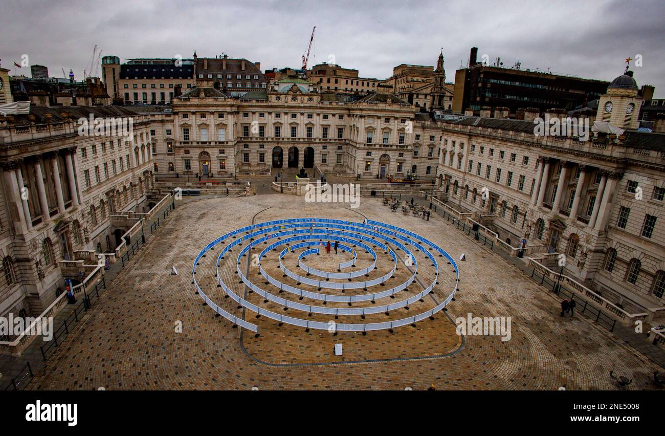 London, UK. 16th Feb, 2023. A new artwork Whorled (Here After Here After Here) at Somerset House. Somerset House unveils 30-metre wide installation, spiralling from the centre of its courtyard The work, by artist Jitish Kallat, uses the visual language of UK road signage to form a giant spiral of signs to places across the universe. Credit: Mark Thomas/Alamy Live News Stock Photo
