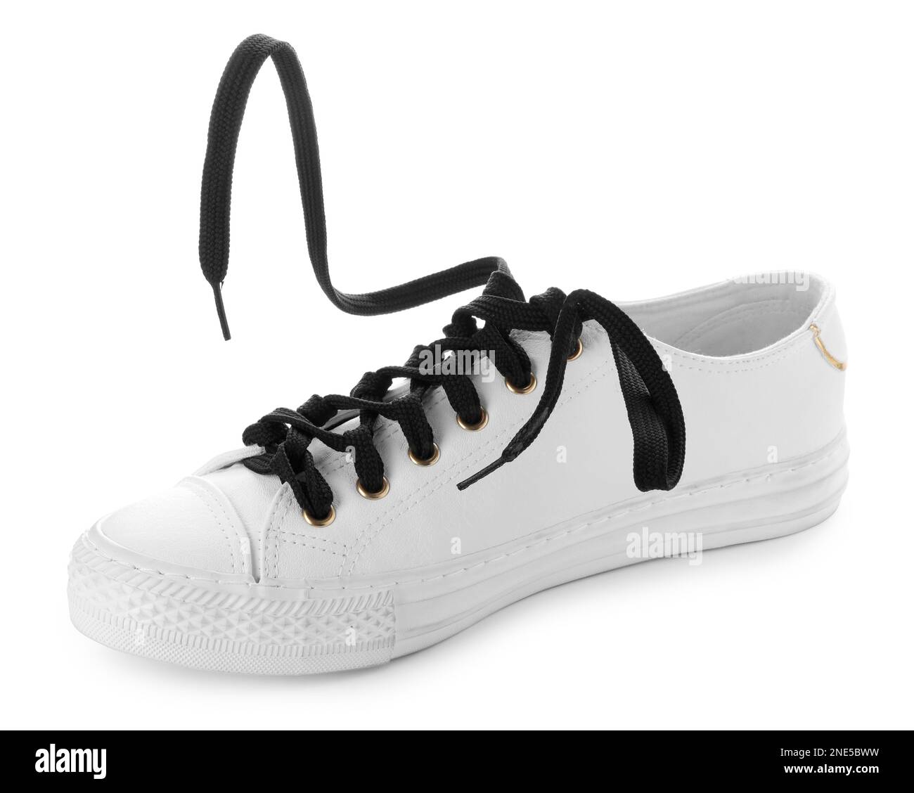 Stylish sneaker with black shoelaces on white background Stock Photo