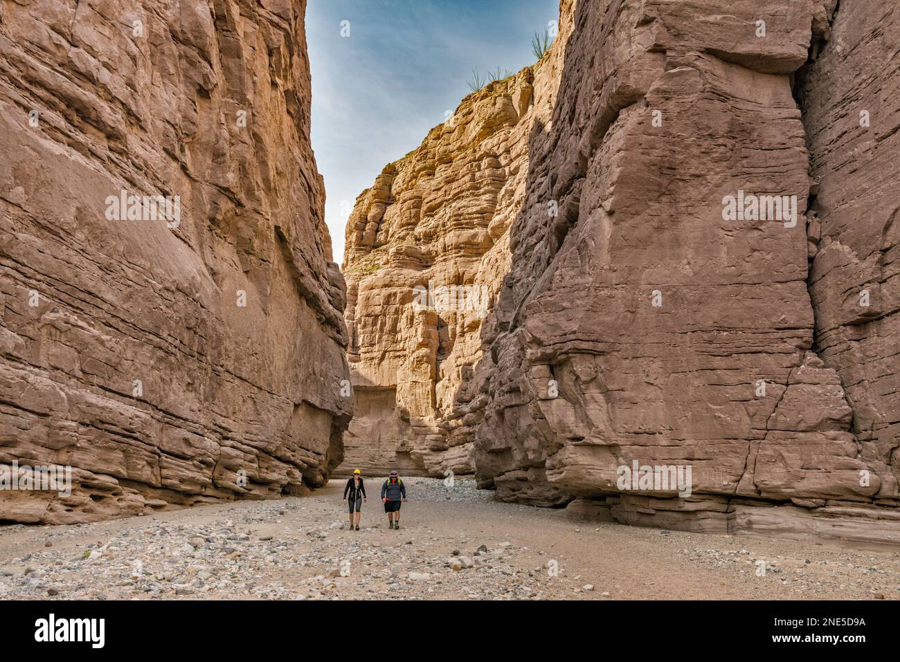 Hikers, sheer walls at Painted Canyon, Mecca Hills Wilderness, Colorado