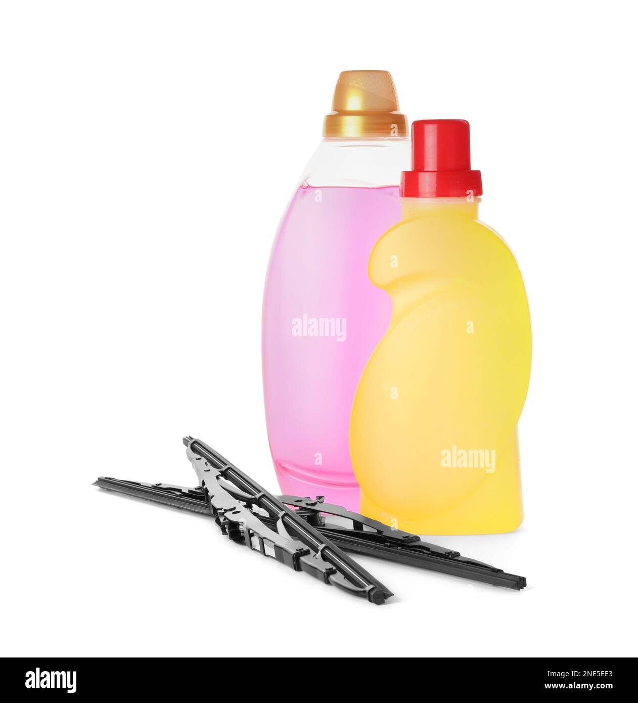 Bottles of windshield washer fluids and wipers on white background