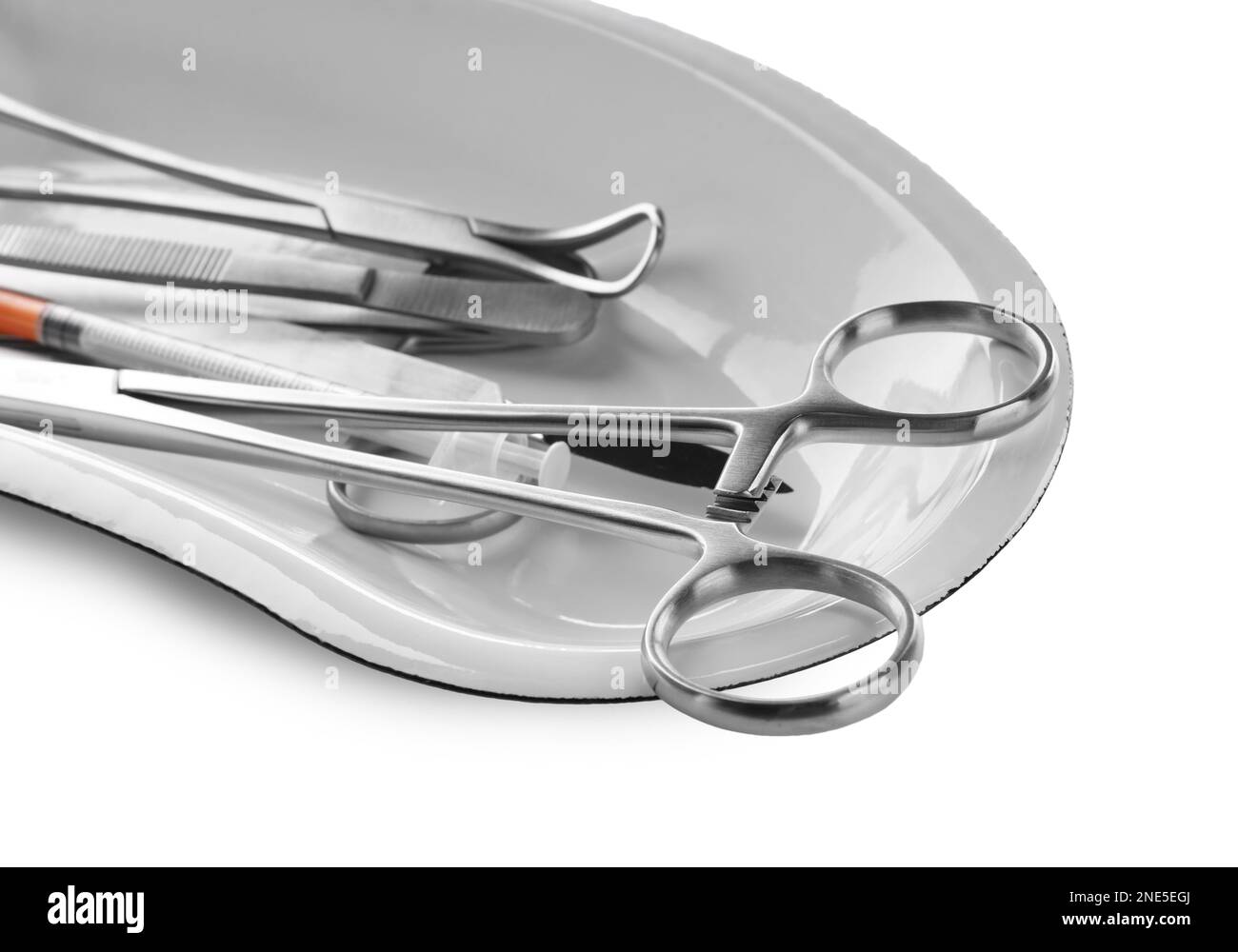 Surgical instruments in kidney dish on white background, closeup Stock Photo