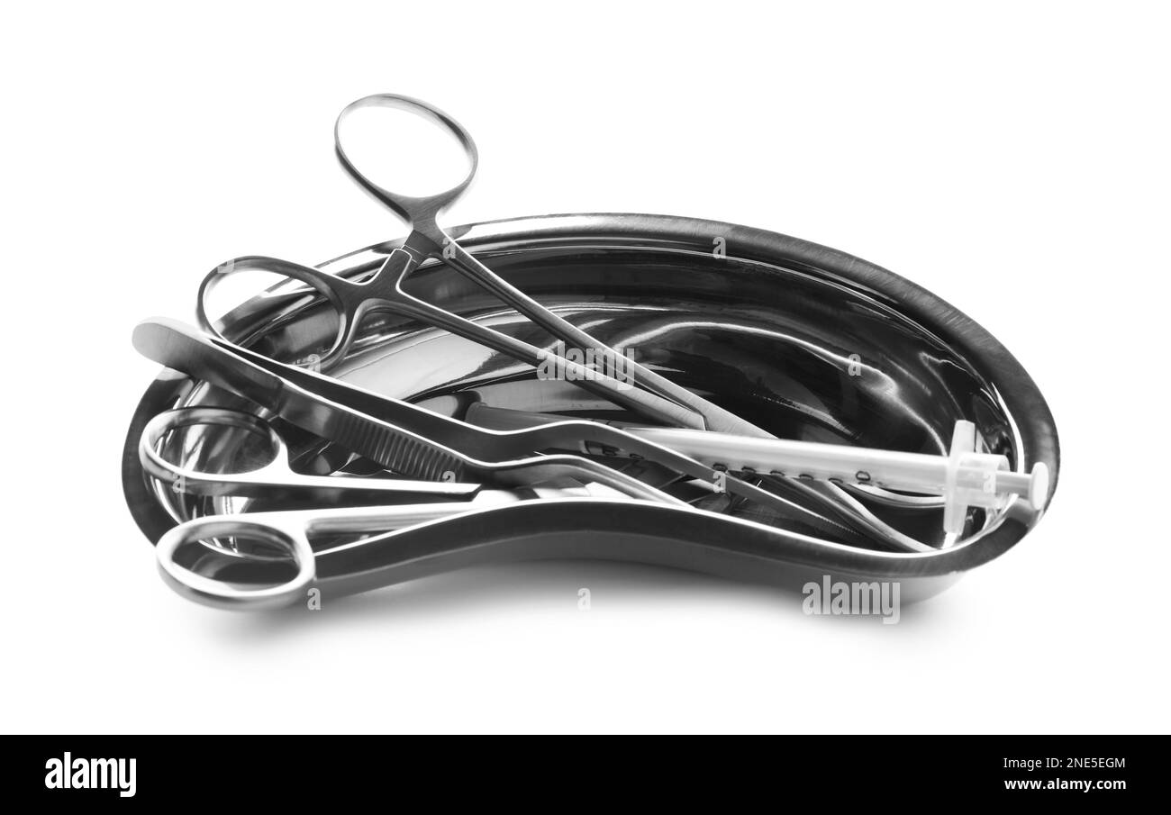 Surgical instruments in kidney dish on white background Stock Photo