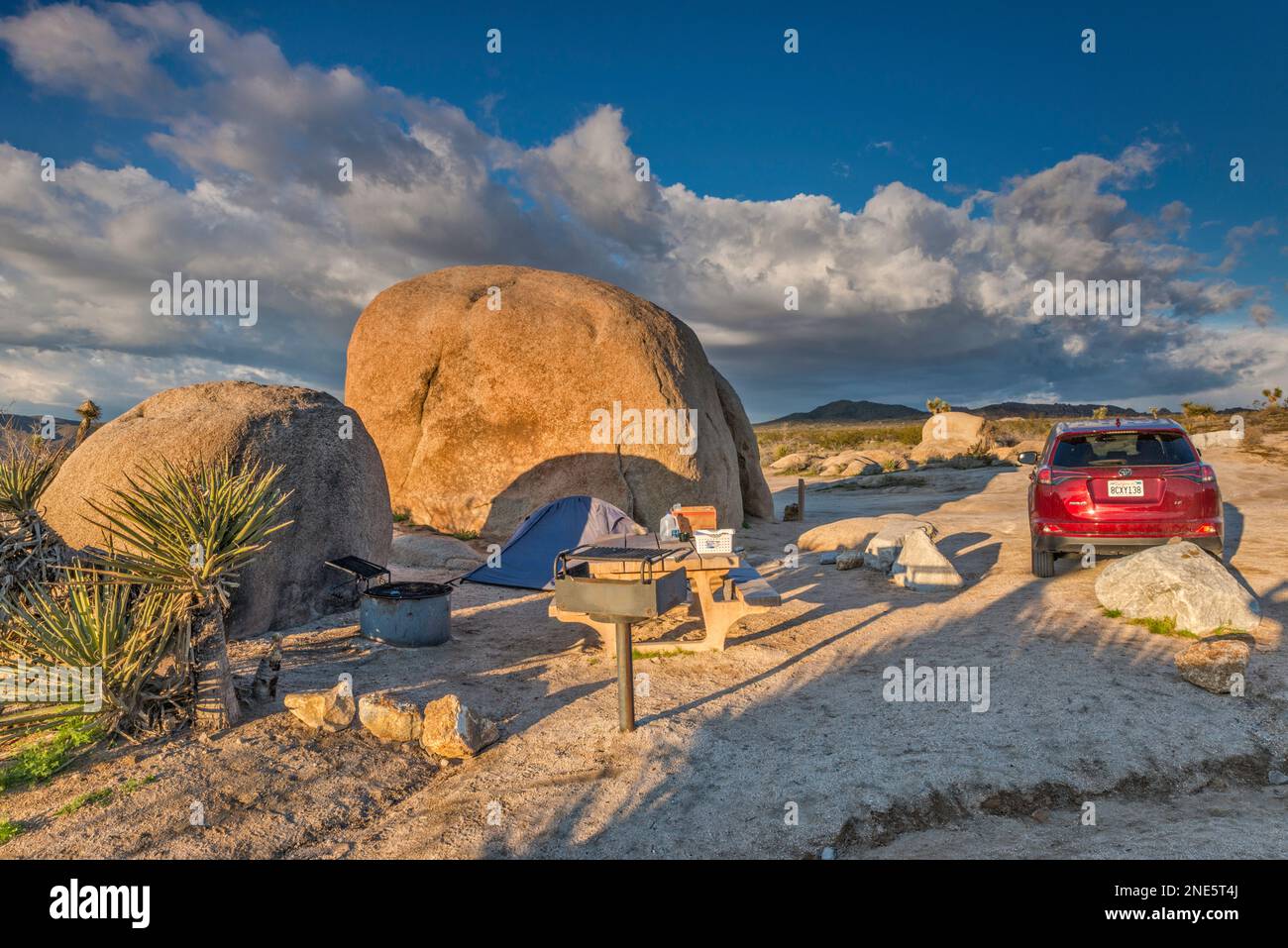 Campsite at granite boulders, White Tank Campground, at sunrise, Mojave