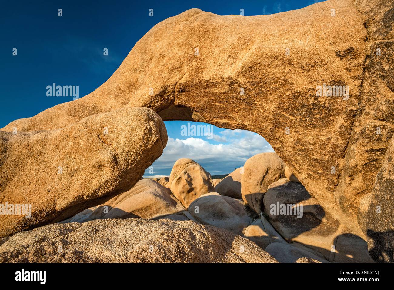 Arch Rock, granite rock near White Tank Campground, at sunrise, Mojave