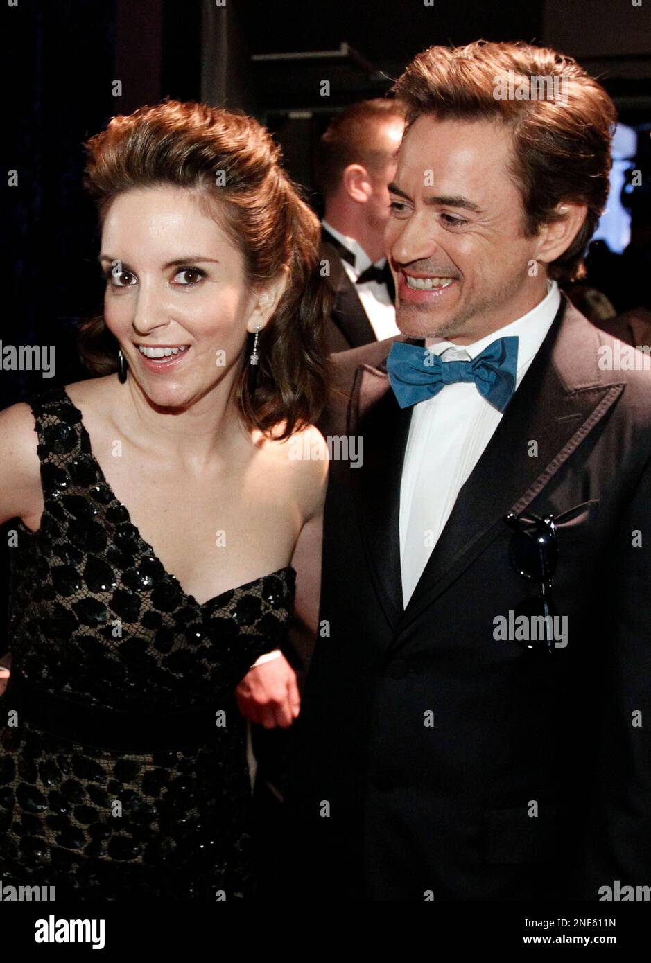 Tina Fey, left, and Robert Downey Jr., right, pose backstage at the