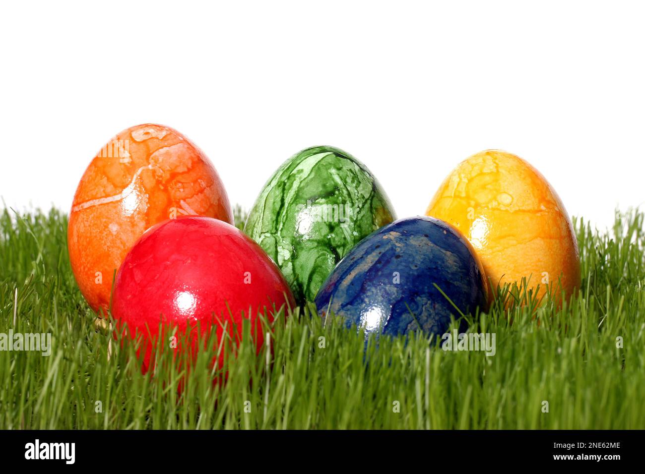 colourful dyed Easter eggs in fresh grass Stock Photo