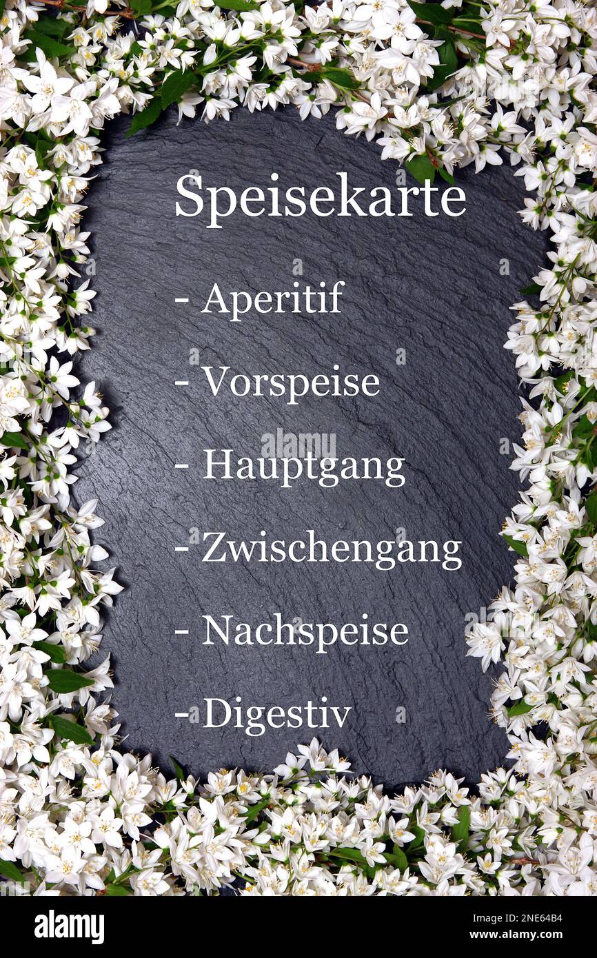 slate with white floral decoration lettering menu Stock Photo
