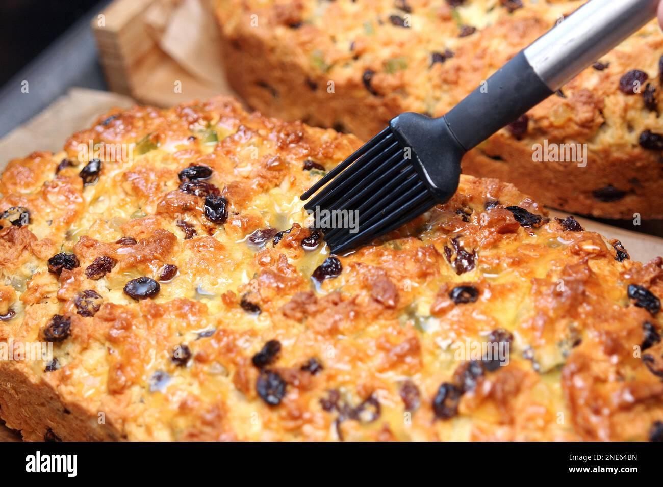Dresden Christstollen is spread with butter Stock Photo - Alamy