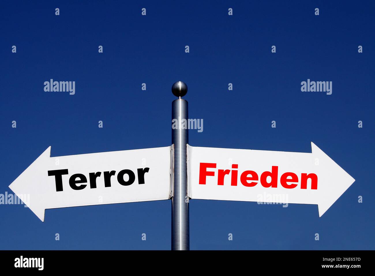 signposts pointing in different directions, options terror - peace Stock Photo