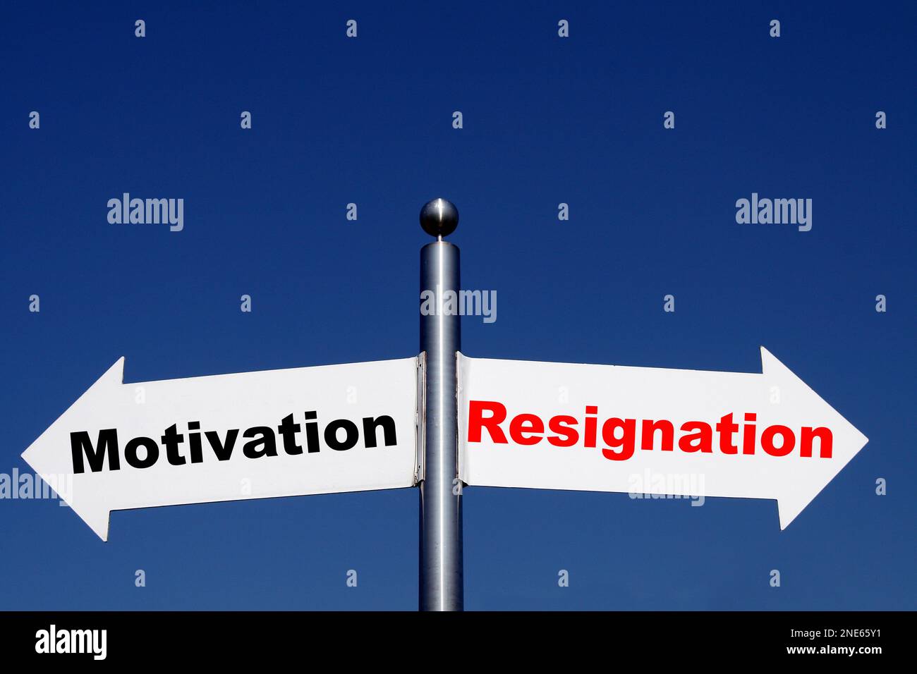 signposts pointing in different directions, options motivation - resignation Stock Photo