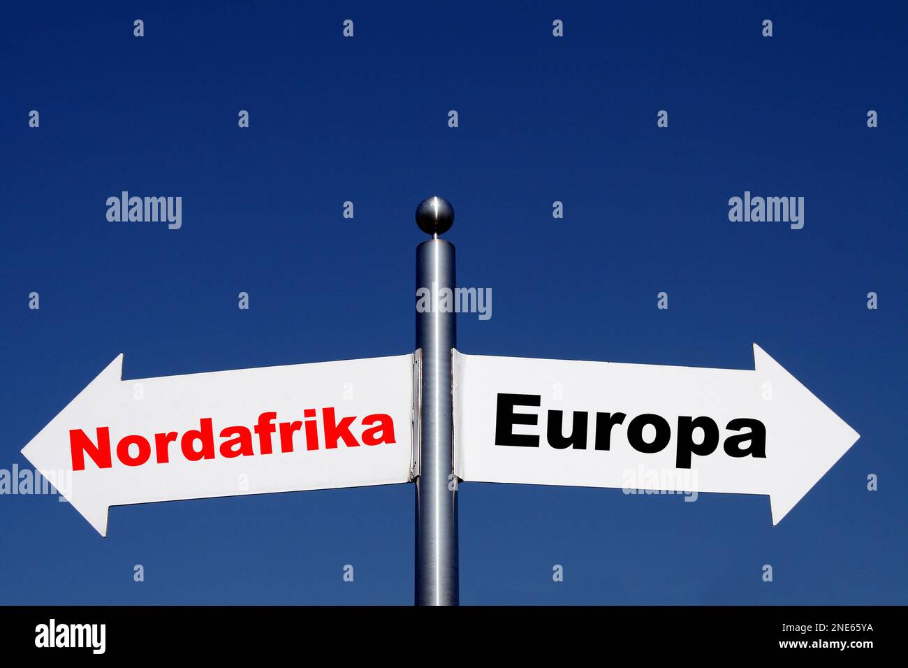 signposts pointing in different directions, options North Africa - Europa Stock Photo