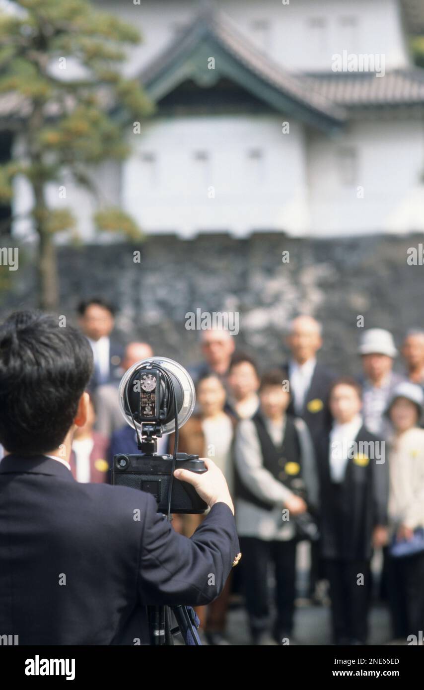 Japan, Tokyo, the royal palace gardens, the 'official' holiday photographer, another one for the photo album. Stock Photo